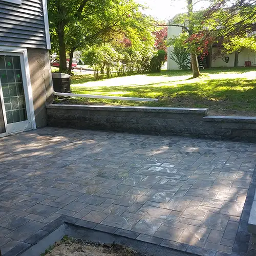 a patio with blue pavers
